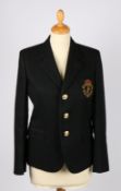 An Yves Saint Laurent black wool blazer with embroidered insignia, size 38 165/88Y.