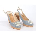 A pair of Chanel cork heels with blue canvas stripe upper and CC logo to the toe. Size 36