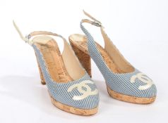 A pair of Chanel cork heels with blue canvas stripe upper and CC logo to the toe. Size 36