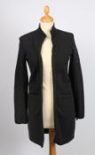 A Chanel black wool cardigan with front zip fastening and grey CC emblem to the sleeve, size 34