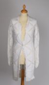 Two Chanel garments; A long length cotton white knitted jacket with geometric patterns and ruffled