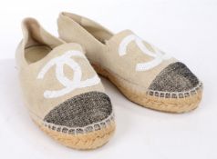 A pair of Chanel beige canvas espadrilles with sequinned CC logo and grey toe cap. Size 36