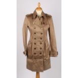 A Burberry of London classic beige mackintosh trench coat, size FRA 36