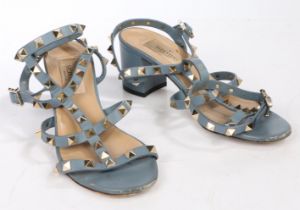 A pair of Valentino 'rockstud' slate blue leather block heeled sandals with gold studs and