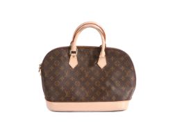 A Louis Vuitton Alma MM bag, with monogrammed leather exterior, 33cm wide, 24.5cm high