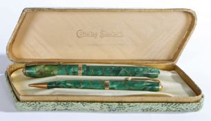 A Conway Stewart 84 fountain pen and no.26 propelling pencil, with green marble effect bodies, the