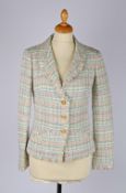 A Chanel pastel tweed jacket with amber coloured enamel CC logo buttons, size 34.