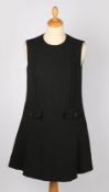 A Prada sleeveless black mini-dress with fabric covered buttons, size 38.