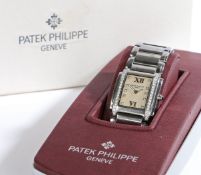A Patek Philippe Geneve Twenty-4 ladies stainless steel and diamond wristwatch, the signed white