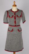 A Gucci hounds tooth short sleeve dress with contrasting red trim and gilt pearl logo buttons,