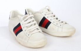 A pair of Gucci white leather trainers with green and red stripe. Size 34