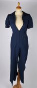 A Gucci navy blue short sleeved belted jumpsuit, unworn with original tags attached, size 38.