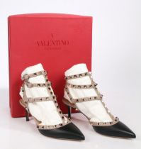 A pair of Valentino 'rockstud' black leather heels with beige trim and gold studs, unworn with