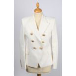 A Balmain white textured cotton double breasted jacket with gold buttons, size 38.