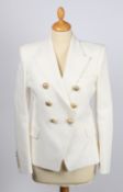 A Balmain white textured cotton double breasted jacket with gold buttons, size 38.