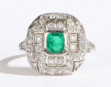 An Art Deco style 18 carat white gold, platinum set emerald and diamond ring, the central square cut