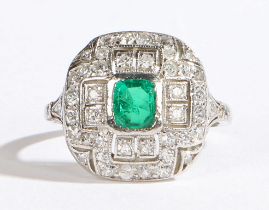 An Art Deco style 18 carat white gold, platinum set emerald and diamond ring, the central square cut