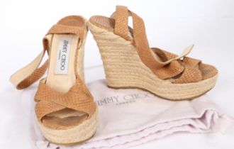 A pair of Jimmy Choo tan leather platform espadrille wedge sandals. Size 34.5