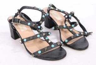 A pair of Valentino Garavani black leather 'rockstud' block heeled sandals with turquoise