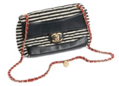 A Chanel Coco Sailor shoulder bag, the quilted black and white striped exterior with black leather