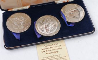 A cased set of three silver Ter-century medals commemorating 300 years of The Royal Observatory at