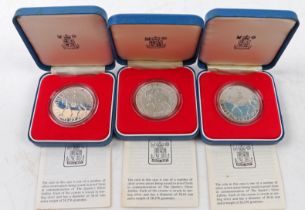 Three Queen Elizabeth II silver jubilee sterling silver crowns, 1977, cased with certificates (3)