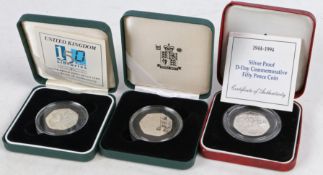 Three Royal Mint silver proof fifty pence coins, 1994 D-Day, 2000 Public libraries, 2005 Samuel