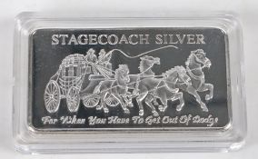 A "stagecoach silver" silver plated ingot, with depiction of a stagecoach, the reverse divided