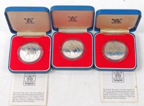 Three Queen Elizabeth II silver jubilee sterling silver crowns, 1977, cased, two with
