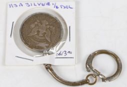 A United States silver half dollar 1964, Kennedy bust verso, mounted as a keyring