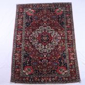 Orientteppich - Wolle, blau- und rotgrundig, zentrales Medaillon, ornamentales und florales Muster,