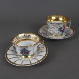 Zwei Tassen mit Untertassen - 19. Jh./um 1900, Porzellan, reicher Golddekor, 1x große Tasse mit pol