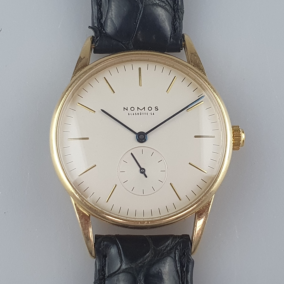 Nomos-Herrenarmbanduhr - "Orion",Gehäuse 18K Gelbgold, Handaufzug, Zifferblatt mit goldfarbenem Stu