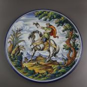 Große Majolika-Wandplatte - 20. Jh., Keramik, polychrom bemalt: Reiter mit Falke in idyllischer Lan