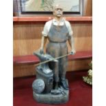 A very well made ceramic statue of the Iron Chancellor, forging the sword. It stands 33" inches in