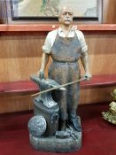 A very well made ceramic statue of the Iron Chancellor, forging the sword. It stands 33" inches in