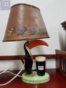 AN ORIGINAL GUINNESS TOUCAN LAMP WITH ORIGINAL SHADE - CARLTONWARE
