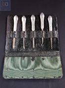 ANTIQUE SILVER HANDLED MANICURE SET IN LEATHER CASE