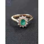 9 CARAT GOLD EMERALD AND DIAMOND RING WITH 0.25 CARAT OF DIAMONDS