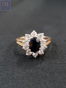 9 CARAT GOLD SAPPHIRE AND CZ RING