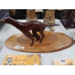 HANDCARVED GREYHOUND ON PLINTH