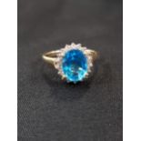 9 CARAT BLUE TOPAZ AND DIAMOND RING