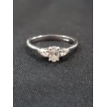 PLATINUM 3 STONE DIAMOND RING - CENTRE OVAL DIAMOND COLOUR D, 0.30 CARAT, CLARITY VS2. 2 SIDE