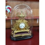 LATE VICTORIAN GILT CLOCK UNDER GLASS DOME