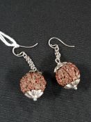 PAIR OF EDWARDIAN SILVER AND NUT SHELL EARRINGS