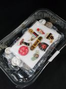 BOX OF WATCH PARTS AND BADGES