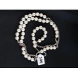 LONG DESIGNER PEARL AND SILVER NECKLACE