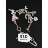 CHARM BRACELET WITH MIXED CHARMS TO INCLUDE HORSESHOE, PERFUME BOTTLE, HIGH HEEL ETC