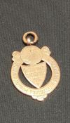9 CARAT GOLD COUNTY ANTRIM F.A QUALIFYING COMPETITION MEDAL TO J.MCKNIGHT OF B.C.F.C 2ND XI 1915