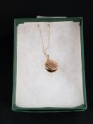 9 CARAT GOLD LOCKET AND CHAIN